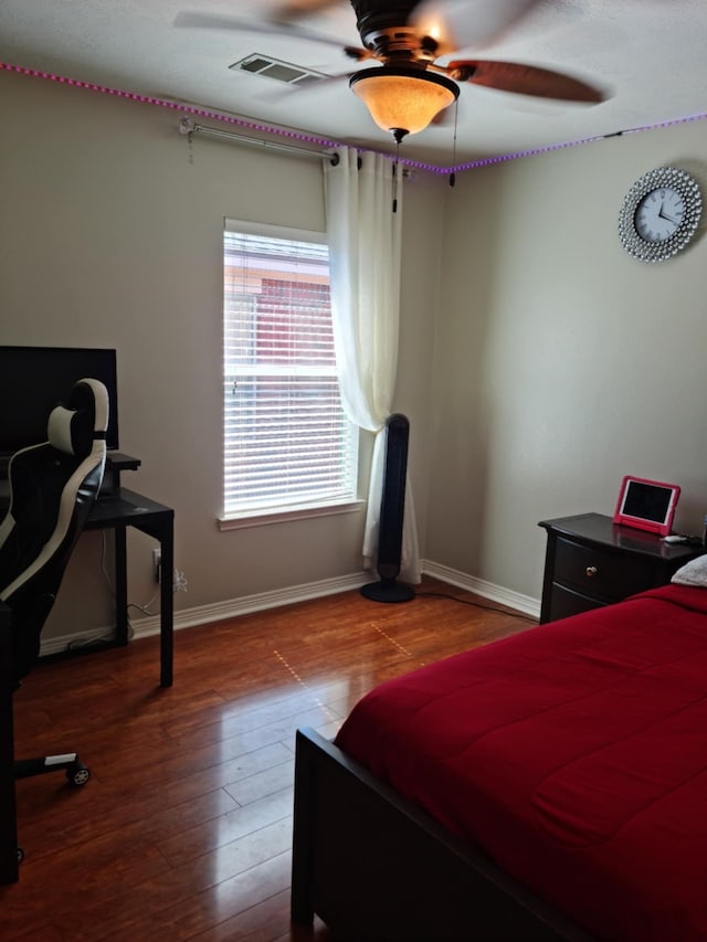 19626 Tularosa Ln, Tomball, TX 77377 - bedroom featuring baseboards, wood finished floors, and a ceiling fan