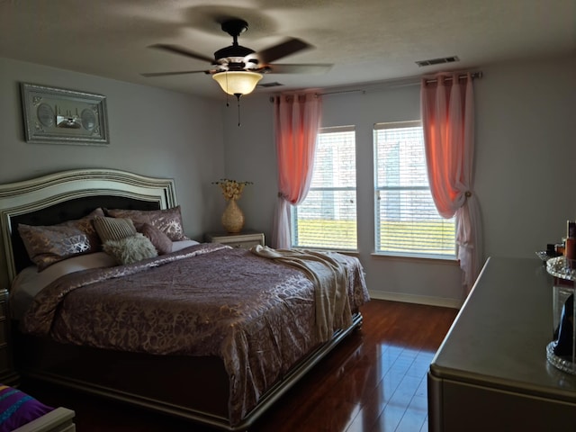 19626 Tularosa Ln, Tomball, TX 77377 - bedroom with dark wood-style flooring, baseboards, and ceiling fan