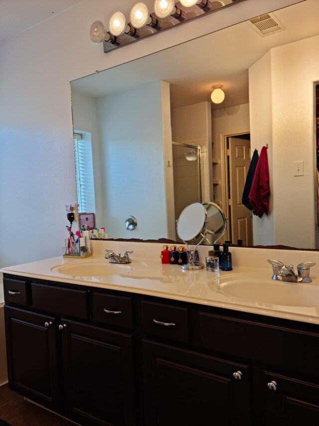 19626 Tularosa Ln, Tomball, TX 77377 - bathroom with double vanity and a stall shower