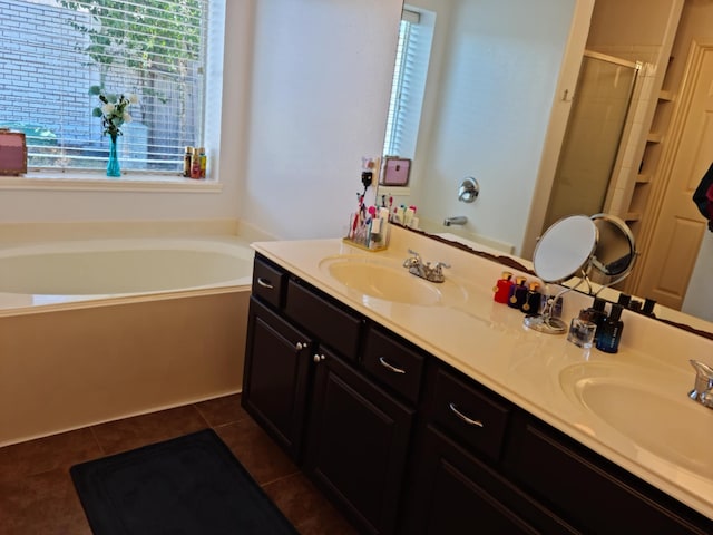 19626 Tularosa Ln, Tomball, TX 77377 - bathroom featuring plenty of natural light, double vanity, a stall shower, and a garden tub