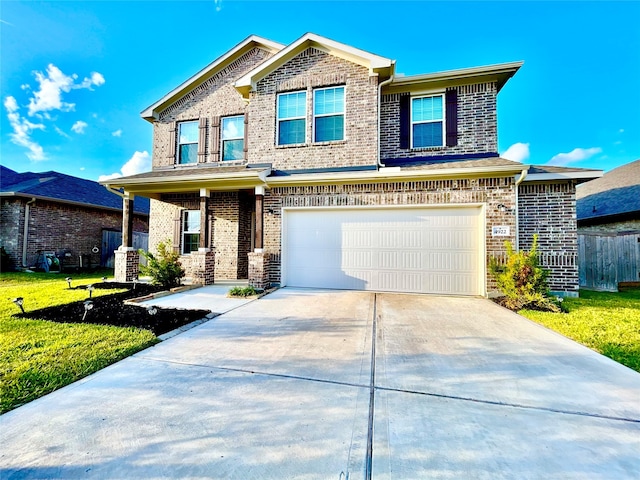 view of front of home featuring a garage and a front lawn