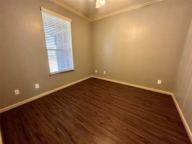 spare room featuring crown molding, dark hardwood / wood-style floors, and ceiling fan