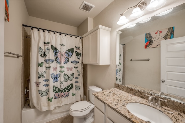 full bathroom featuring vanity, shower / tub combo with curtain, toilet, and tile patterned flooring