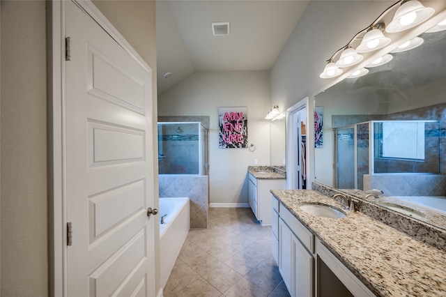 bathroom featuring vanity, lofted ceiling, tile patterned floors, and separate shower and tub