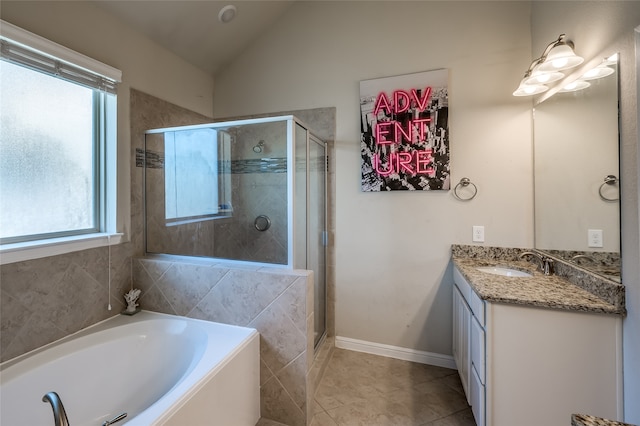 bathroom featuring a wealth of natural light, lofted ceiling, vanity, and shower with separate bathtub