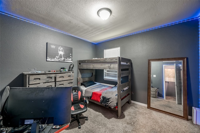 carpeted bedroom featuring a textured ceiling