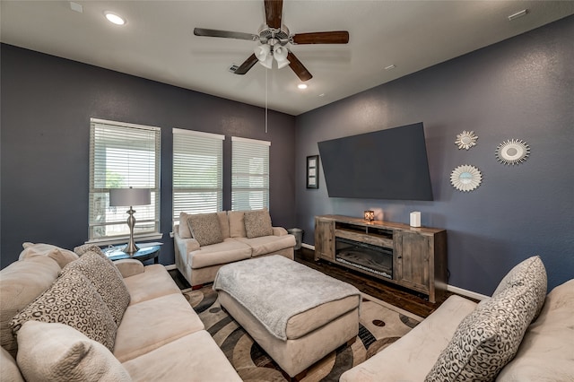 living room featuring ceiling fan and hardwood / wood-style floors