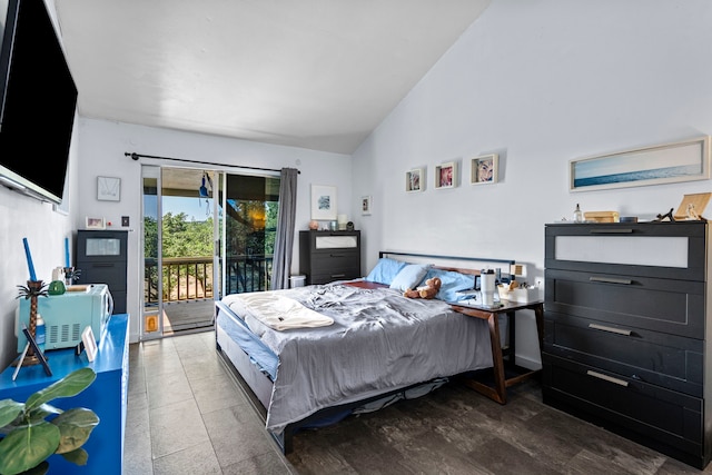 bedroom featuring high vaulted ceiling, dark hardwood / wood-style floors, and access to exterior