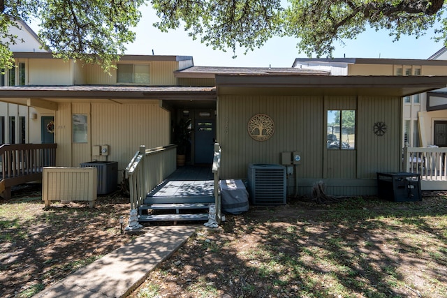 exterior space with central AC and a wooden deck