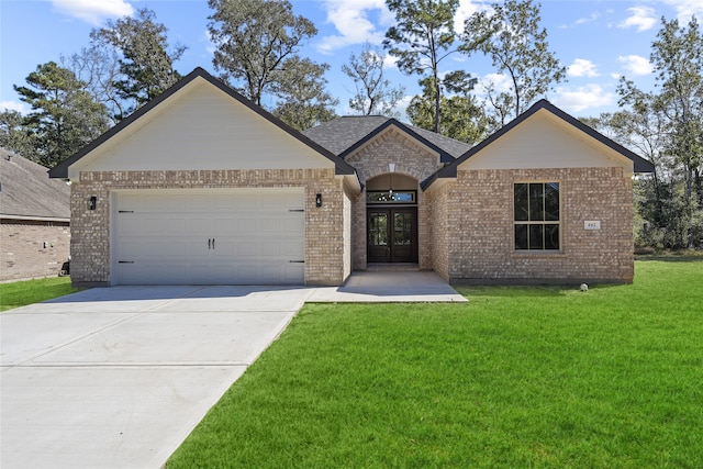 view of front facade with french doors, a front lawn, and a garage