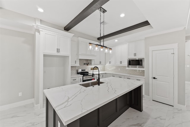 kitchen featuring light stone countertops, an island with sink, backsplash, white cabinetry, and stainless steel appliances