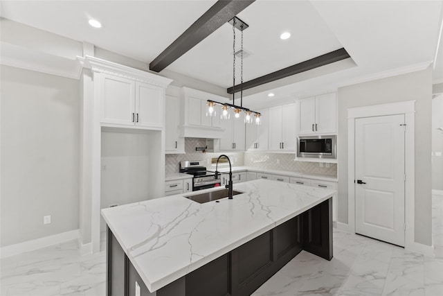 kitchen with a kitchen island with sink, stainless steel appliances, a sink, white cabinets, and light stone countertops