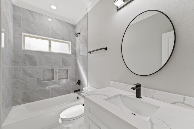 full bathroom with toilet, crown molding, vanity, and tiled shower / bath