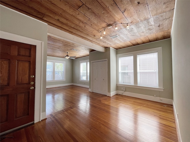 foyer entrance with hardwood / wood-style floors, wooden ceiling, ceiling fan, and track lighting