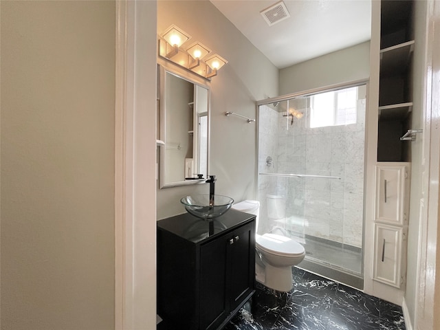 bathroom with walk in shower, vanity, and toilet