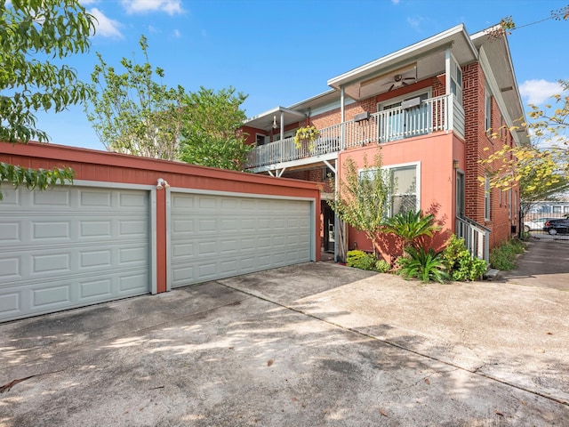 front of property with a garage and a balcony