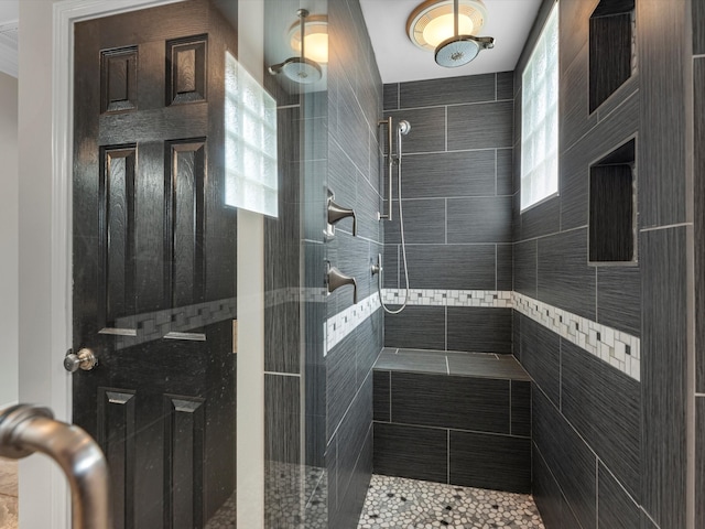 bathroom with tiled shower