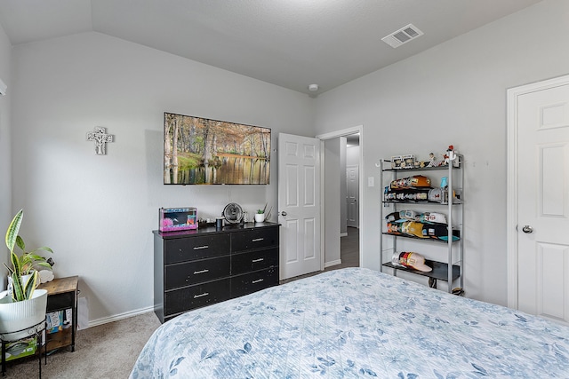 carpeted bedroom featuring vaulted ceiling