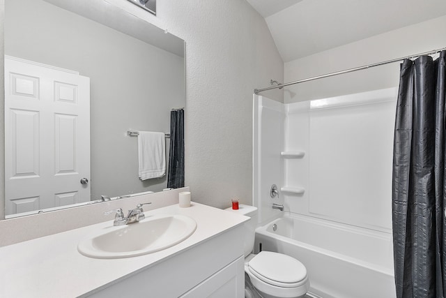 full bathroom with vanity, vaulted ceiling, shower / bath combo, and toilet