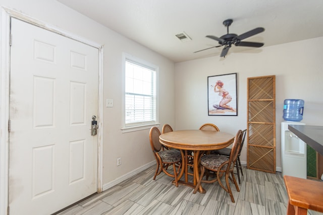 dining space with ceiling fan