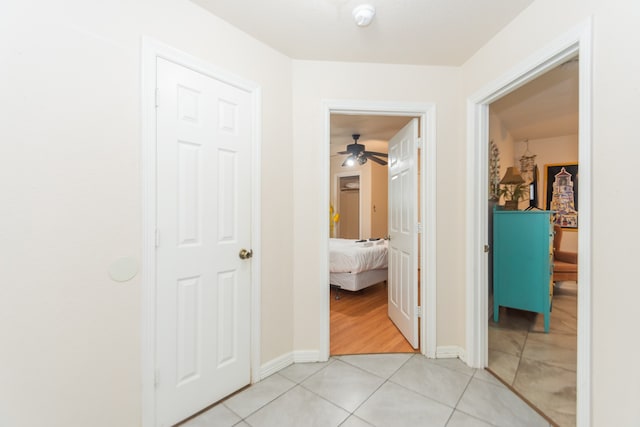 hallway featuring light tile patterned flooring