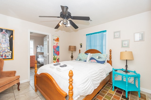 tiled bedroom with ceiling fan