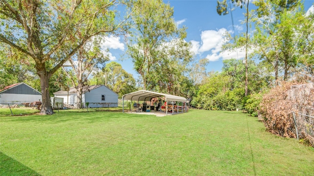 view of yard with a carport