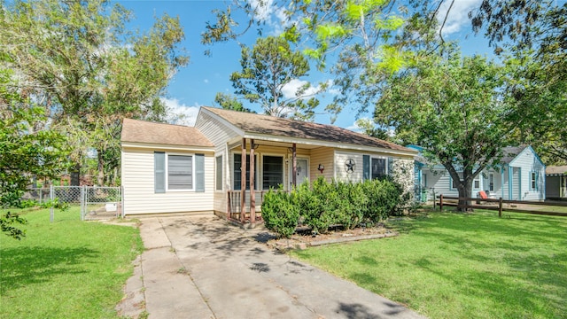 view of front of house featuring a front yard and covered porch