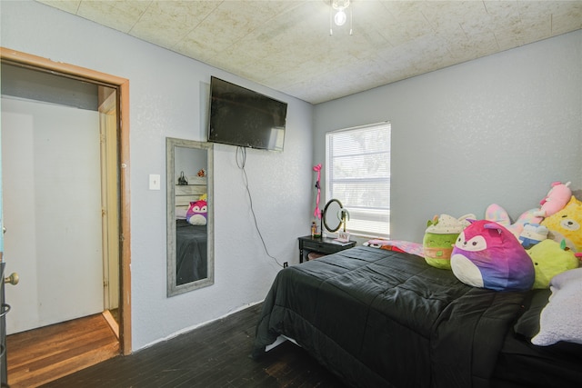 bedroom featuring dark hardwood / wood-style flooring