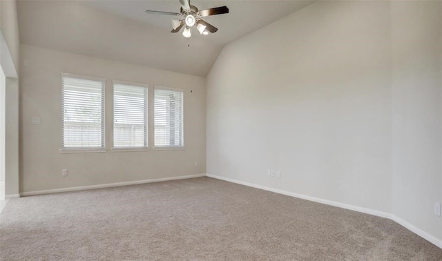 carpeted empty room featuring lofted ceiling and ceiling fan