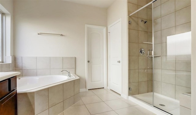 bathroom with vanity, independent shower and bath, and tile patterned flooring