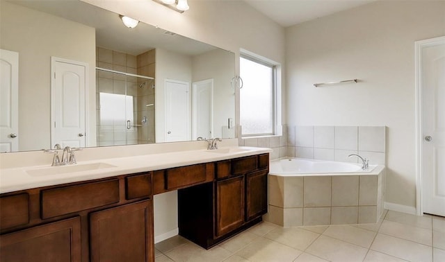 bathroom featuring vanity, plus walk in shower, and tile patterned flooring