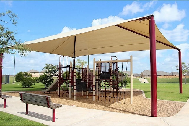 view of playground with a lawn