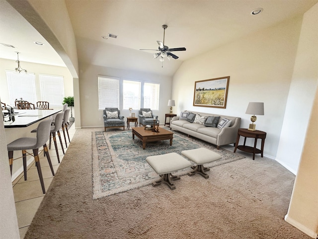 carpeted living room featuring lofted ceiling and ceiling fan