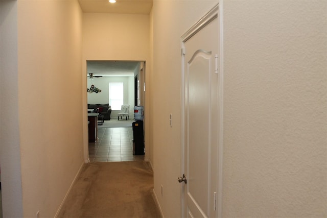 corridor featuring tile patterned flooring