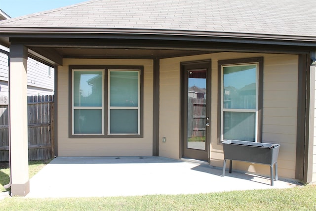 entrance to property featuring a patio