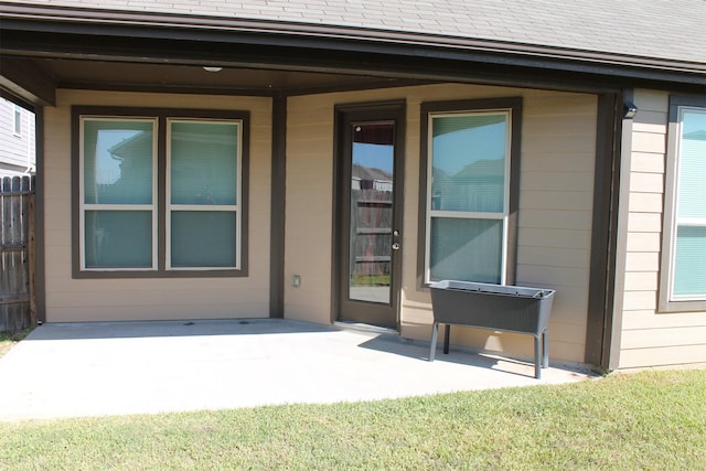 doorway to property with a patio area