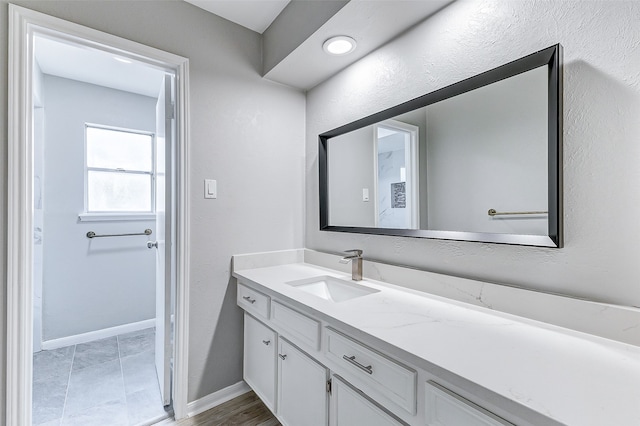 bathroom featuring vanity and tile patterned flooring