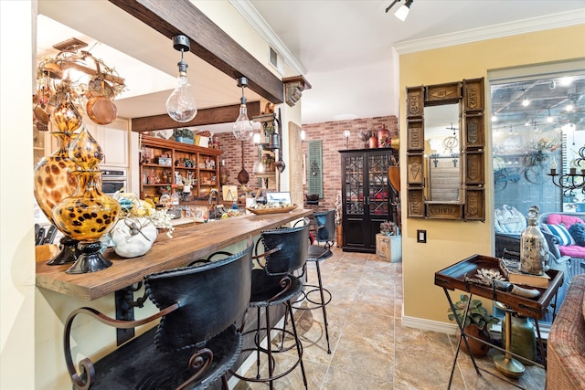 bar featuring oven, hanging light fixtures, wooden counters, crown molding, and brick wall