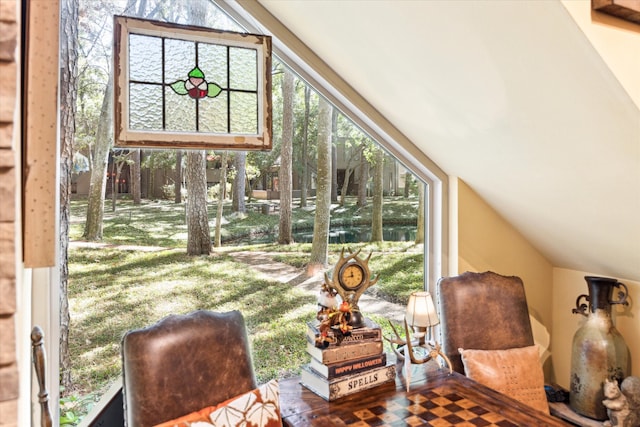 sunroom / solarium featuring lofted ceiling and a wealth of natural light