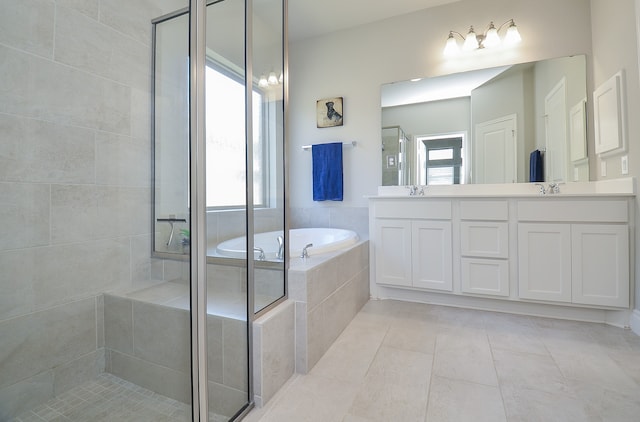 bathroom featuring vanity, separate shower and tub, and tile patterned flooring