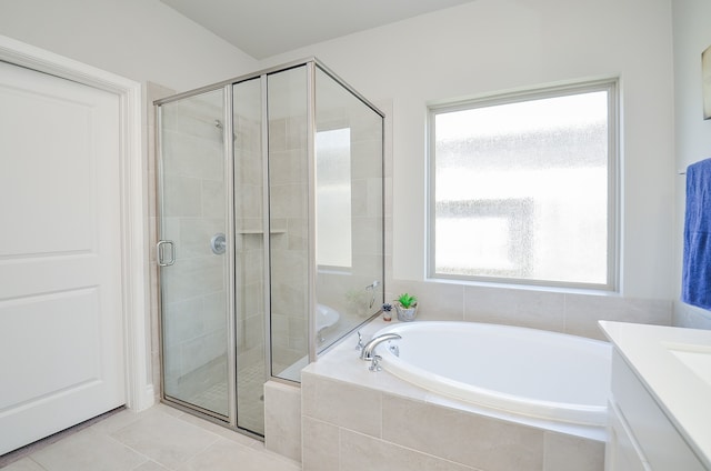 bathroom with vanity, tile patterned floors, separate shower and tub, and a wealth of natural light