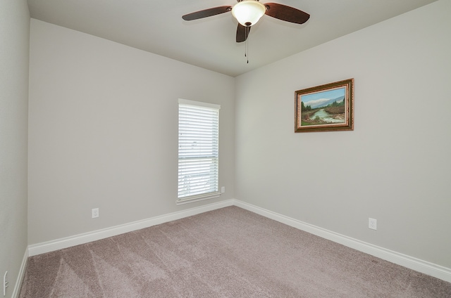 carpeted empty room with ceiling fan