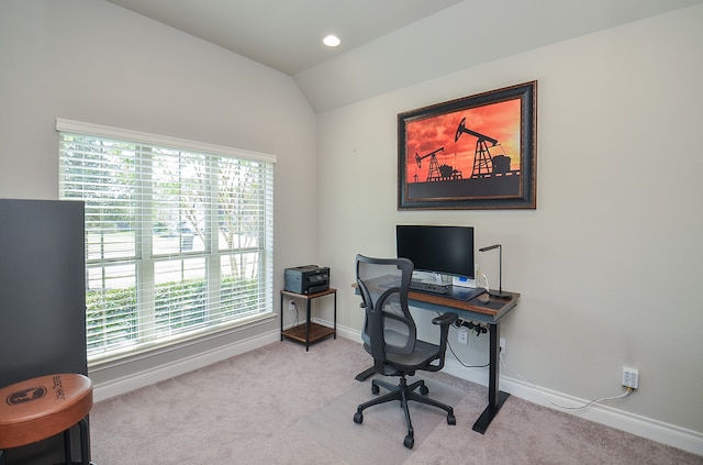 office featuring light carpet and vaulted ceiling