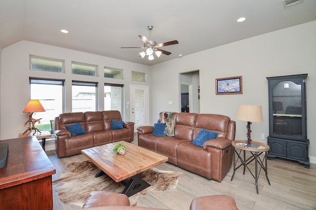 living room featuring ceiling fan and light hardwood / wood-style flooring