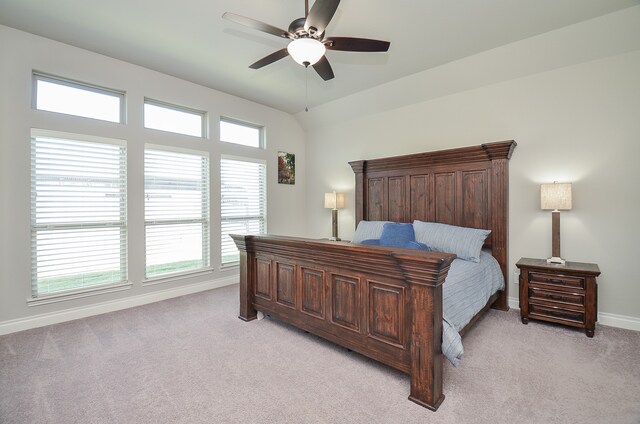 bedroom featuring light colored carpet and ceiling fan