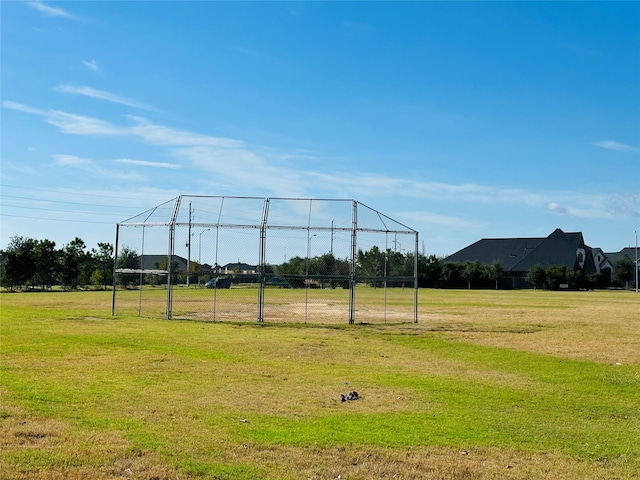 view of home's community with a yard