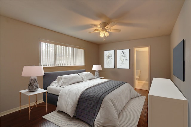 bedroom featuring a ceiling fan, wood finished floors, baseboards, and ensuite bathroom