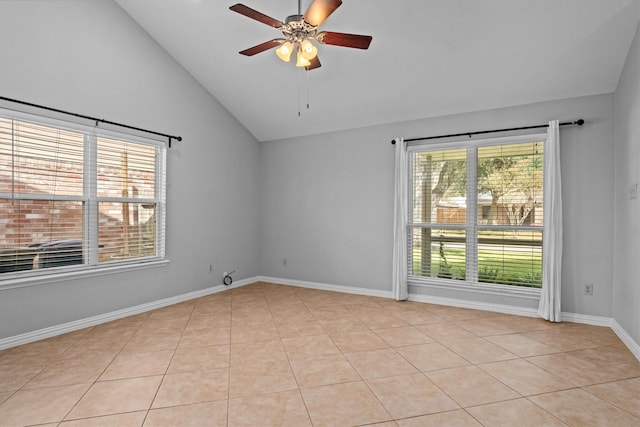 tiled empty room featuring ceiling fan and lofted ceiling