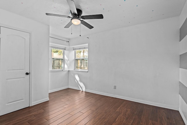 unfurnished bedroom with ceiling fan and dark hardwood / wood-style flooring